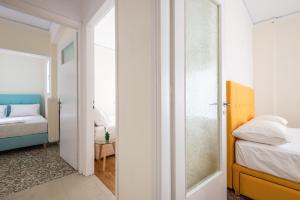 Posteľ alebo postele v izbe v ubytovaní Acropolis View Paradise Apartments