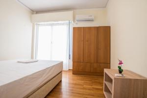 Posteľ alebo postele v izbe v ubytovaní Acropolis View Paradise Apartments