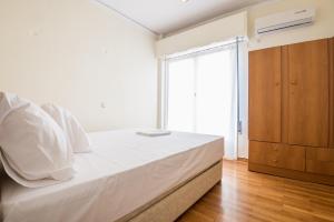 Posteľ alebo postele v izbe v ubytovaní Acropolis View Paradise Apartments