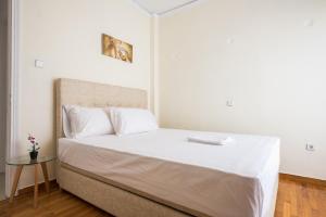 Posteľ alebo postele v izbe v ubytovaní Acropolis View Paradise Apartments