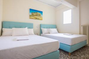 Posteľ alebo postele v izbe v ubytovaní Acropolis View Paradise Apartments