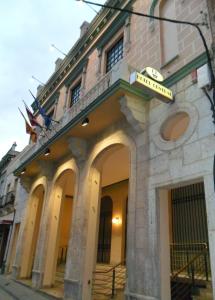 a building with a sign on the front of it at Hotel Central in Valdepeñas