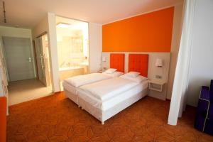 Postel nebo postele na pokoji v ubytování Hotel Waldperle