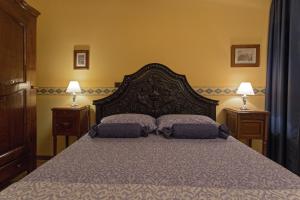 Postel nebo postele na pokoji v ubytování B&B Contrada dei Giardini