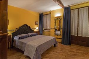Postel nebo postele na pokoji v ubytování B&B Contrada dei Giardini