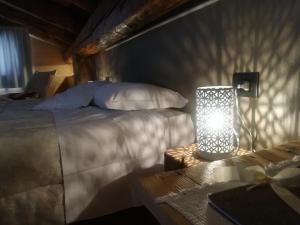 Llit o llits en una habitació de Albergo Pa' Krhaizar