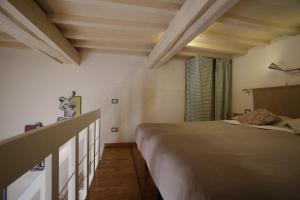 Ένα ή περισσότερα κρεβάτια σε δωμάτιο στο A Casa Di Olga