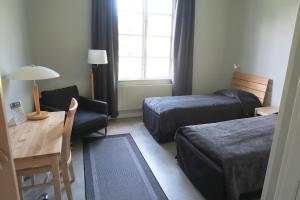 Un pat sau paturi într-o cameră la Hagabergs Vandrarhem
