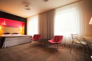 Posteľ alebo postele v izbe v ubytovaní Hotel Cristal Białystok