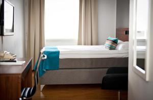 Кровать или кровати в номере Apple Hotel & Konferens Göteborg