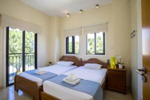 Giường trong phòng chung tại Villa Mylos 7 +51 ảnh