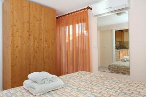 Posteľ alebo postele v izbe v ubytovaní Adriana casa vacanze mare Etna Sicilia