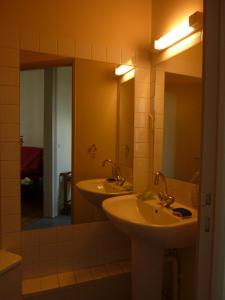 a bathroom with two sinks and a large mirror at 36 Pollet in Dieppe