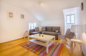 a living room with a couch and a table at Casa Mouraria in Lisbon