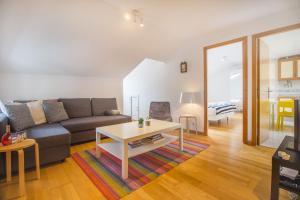 a living room with a couch and a table at Casa Mouraria in Lisbon