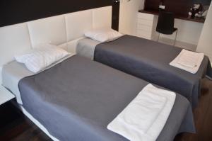 Postel nebo postele na pokoji v ubytování Apartament Wzgórze Słowików