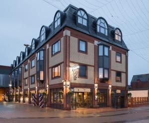 a large brick building on a city street at The Troll Cart Wetherspoon in Great Yarmouth