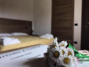 Postel nebo postele na pokoji v ubytování Agriturismo L'Ulivo