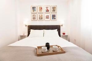 A bed or beds in a room at Old Town, City Center Apartment Premium with PARKING