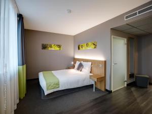 Giường trong phòng chung tại BEST WESTERN Hotel Brussels South