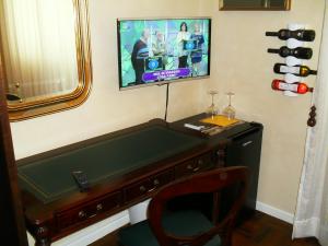 TV a/nebo společenská místnost v ubytování I 13 Cavalieri Guest House