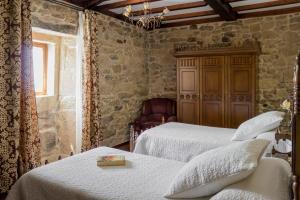 A bed or beds in a room at Casa Roan y Casa Grande
