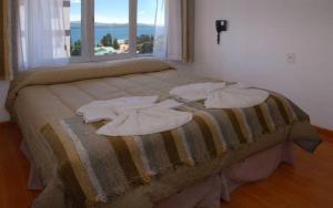 Postel nebo postele na pokoji v ubytování Monte Cervino Hotel