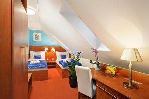 Ein Bett oder Betten in einem Zimmer der Unterkunft Martin Hotel Prague
