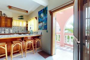 A kitchen or kitchenette at Zinnia @ Caribe Island