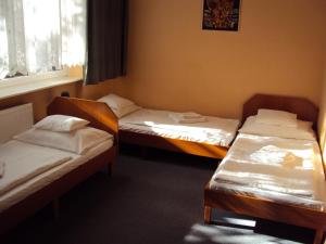 Postel nebo postele na pokoji v ubytování Füzi Panzió + 13 fotografií