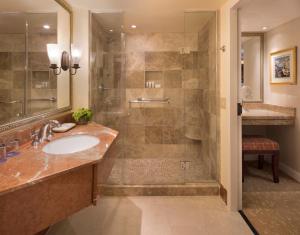 a bathroom with a sink and a shower at Monterey Plaza Hotel & Spa in Monterey