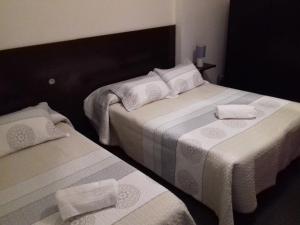 Postel nebo postele na pokoji v ubytování Apartamentos Turísticos Los Ángeles