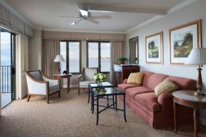 a living room filled with furniture and a couch at Monterey Plaza Hotel & Spa in Monterey