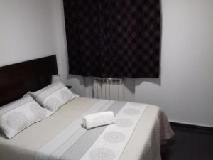 Postel nebo postele na pokoji v ubytování Apartamentos Turísticos Los Ángeles