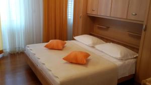 Кровать или кровати в номере Guest house Fenix Brela