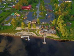 an aerial view of a house on an island in the water at Tervolahovi Lappland in Tervola