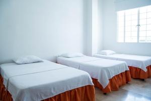 Voodi või voodid majutusasutuse Hotel Savoy toas
