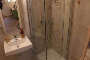 a bathroom with a shower and a sink at Casa Ela in Matera