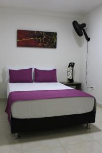 Ένα ή περισσότερα κρεβάτια σε δωμάτιο στο Hotel Pereira 421