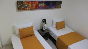 Ένα ή περισσότερα κρεβάτια σε δωμάτιο στο Hotel Pereira 421