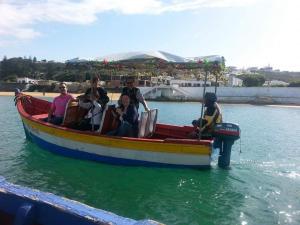 a group of people on a boat in the water at Issablanca in Oualidia