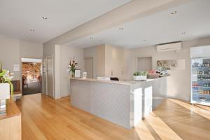 a kitchen with a counter in a room at Adelaide Road Motor Lodge in Murray Bridge