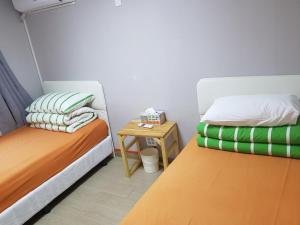 Postel nebo postele na pokoji v ubytování K Guesthouse