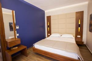 Postel nebo postele na pokoji v ubytování Maxuite Hotel in Home