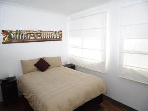 A bed or beds in a room at Jupiter, 3 Scott Street