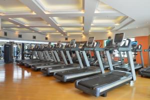 a row of tread machines in a gym at The Kunlun Jing An in Shanghai