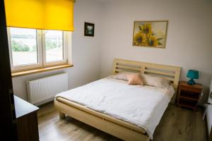Posteľ alebo postele v izbe v ubytovaní Agroturystyka Ogrodniki