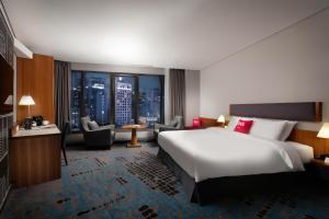 Rúm í herbergi á Ibis Ambassador Myeongdong