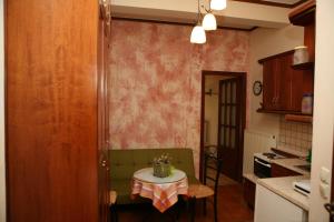 a kitchen with a table with a table cloth on it at Katsios Studios in Parga