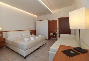 Postel nebo postele na pokoji v ubytování Hotel Florence